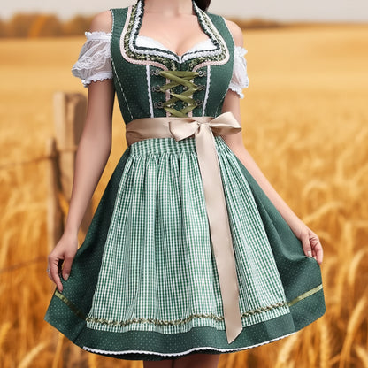 Person wearing a green and white traditional dress with a beige ribbon in a wheat field. Dirndl Midi Länge