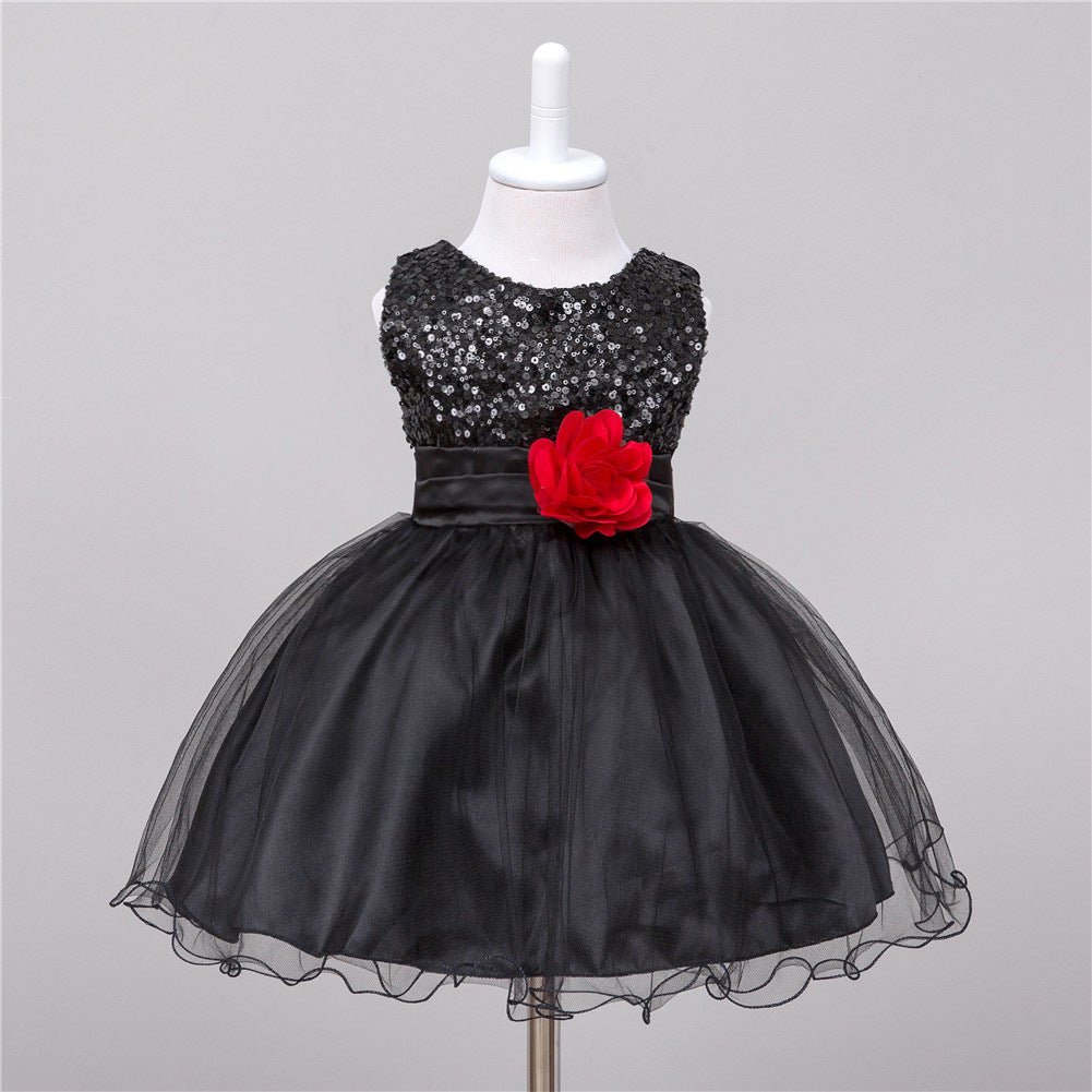 Stylish Princess Dress for Wedding and Photoshoot - Black sequin dress with a red flower on a mannequin 