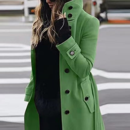 Person wearing a green coat on a street